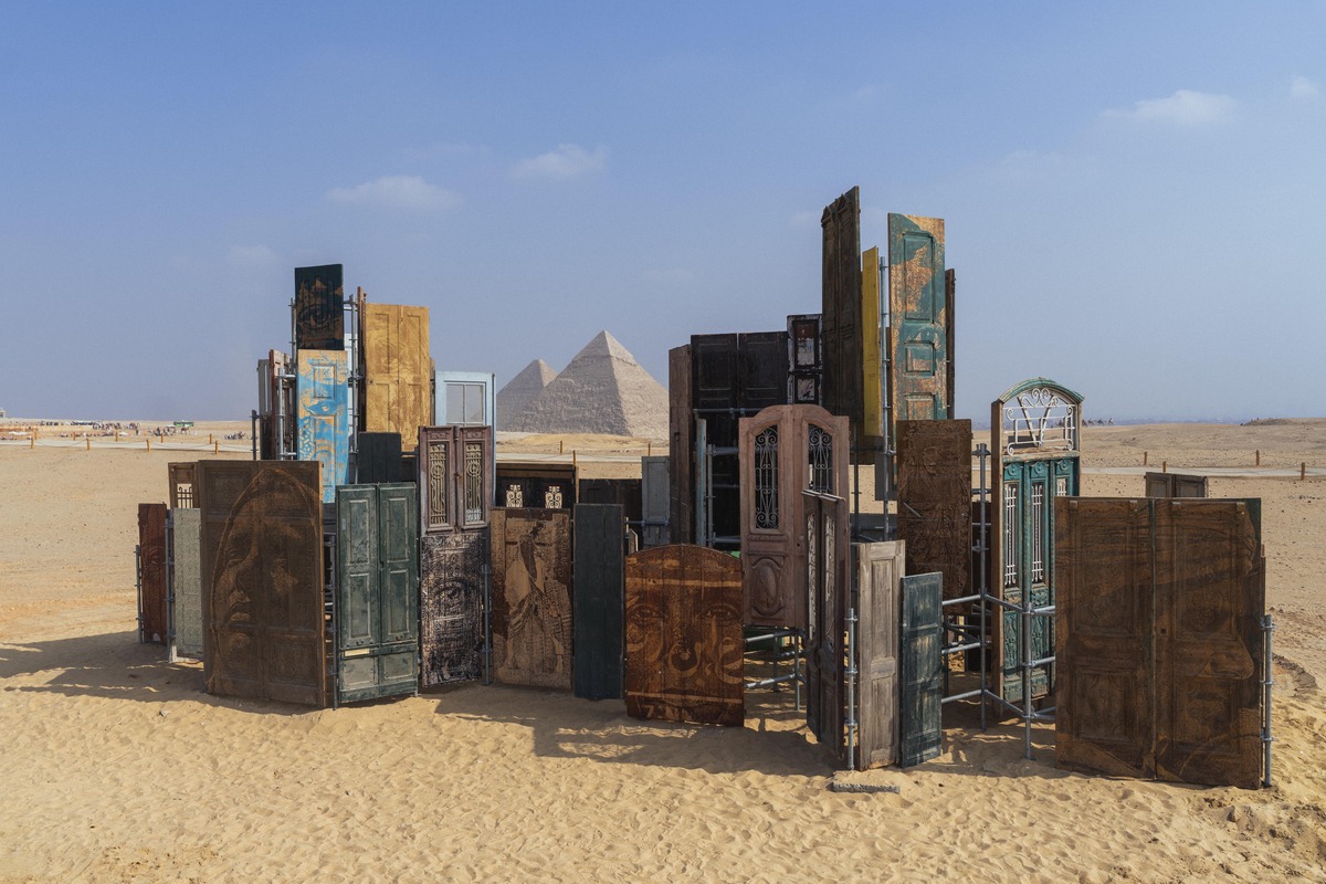 Vhils (Alexandre Farto), Cairo Doors, installation view, Forever Is Now 05, Pyramids of Giza, 2025. Photo: José Pando Lucas. Image courtesy of Art D'Égypte.
